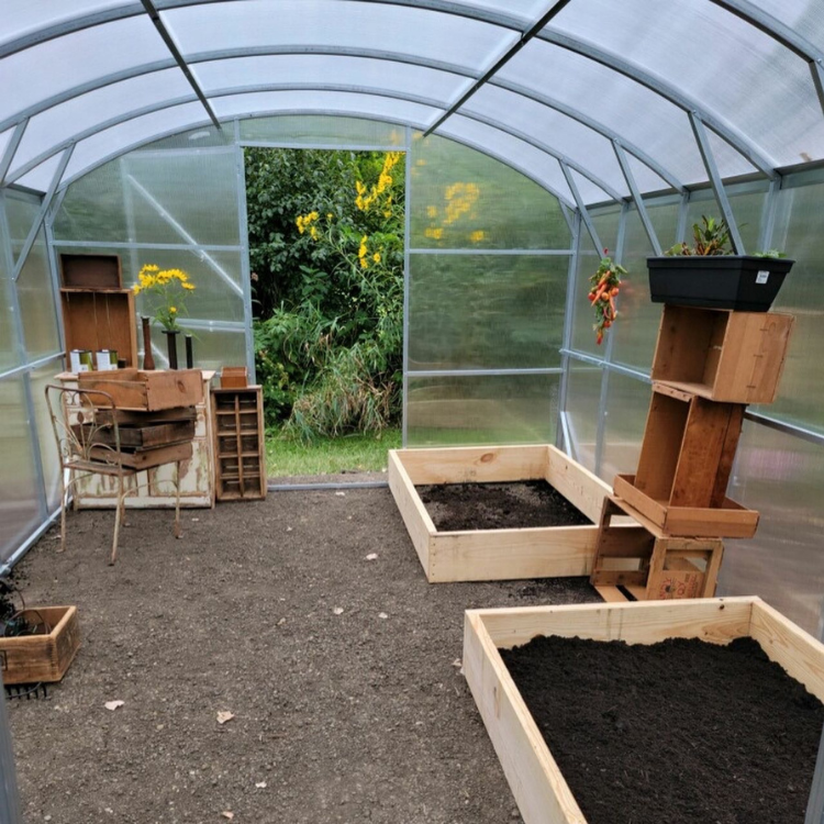 Heavy-duty greenhouse kit with galvanized steel frame and polycarbonate twin walls, designed to withstand harsh weather conditions.